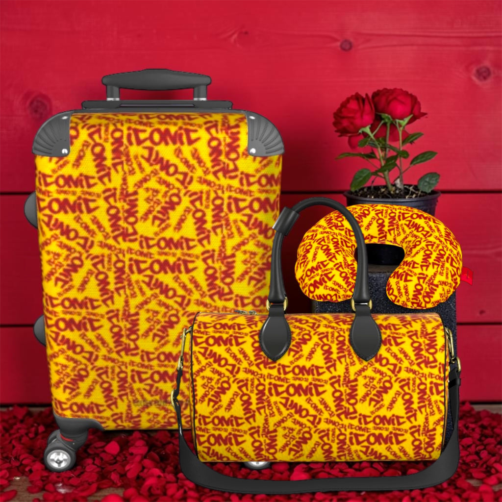 The ICONIC Getaway carry-on styled with The ICONIC Carry duffel and ICONIC neck pillow — full travel set, golden yellow ICONIC print, rose petal backdrop
