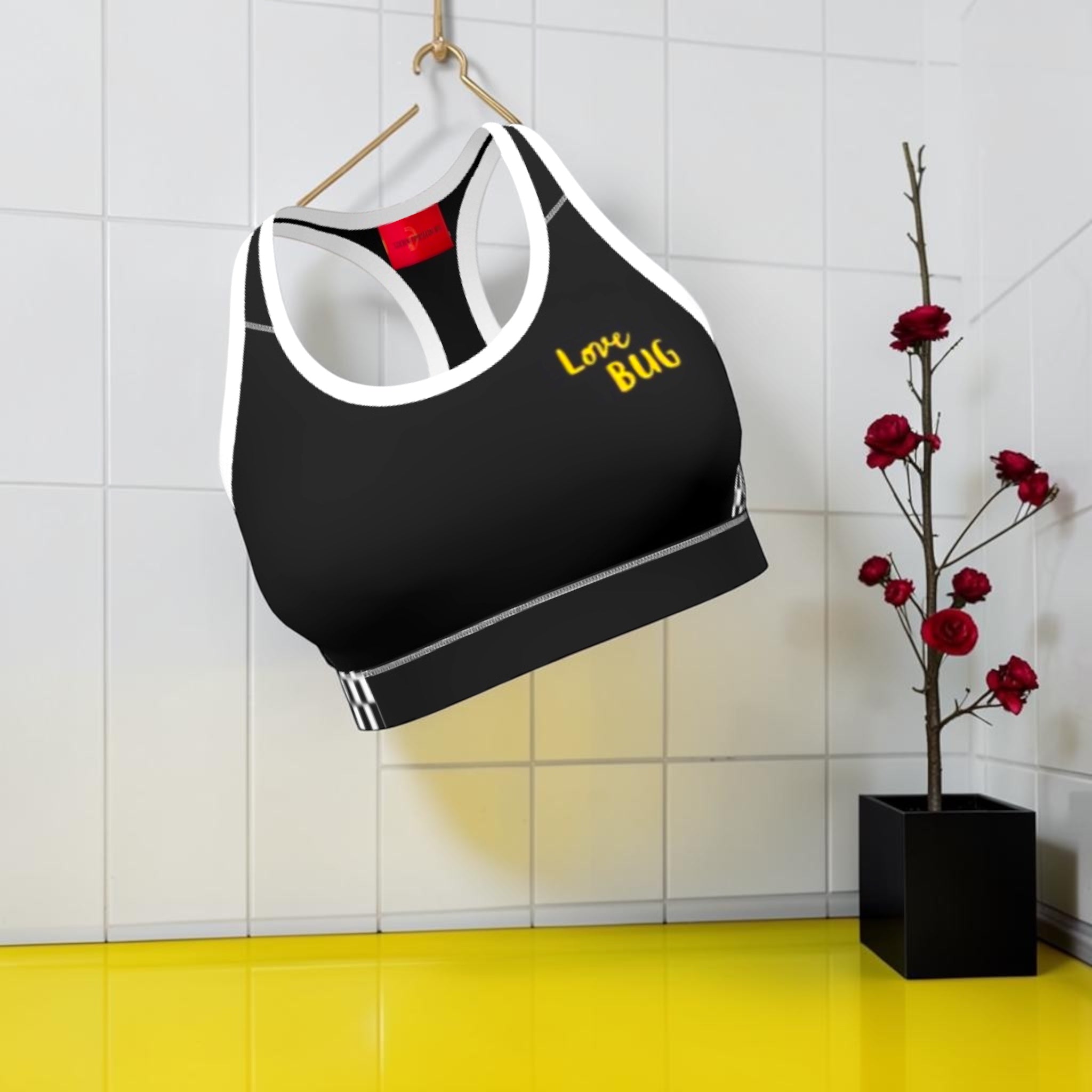 Vol III The Night Racer Sports Bra — front view with gold Love Bug script and white contrast trim