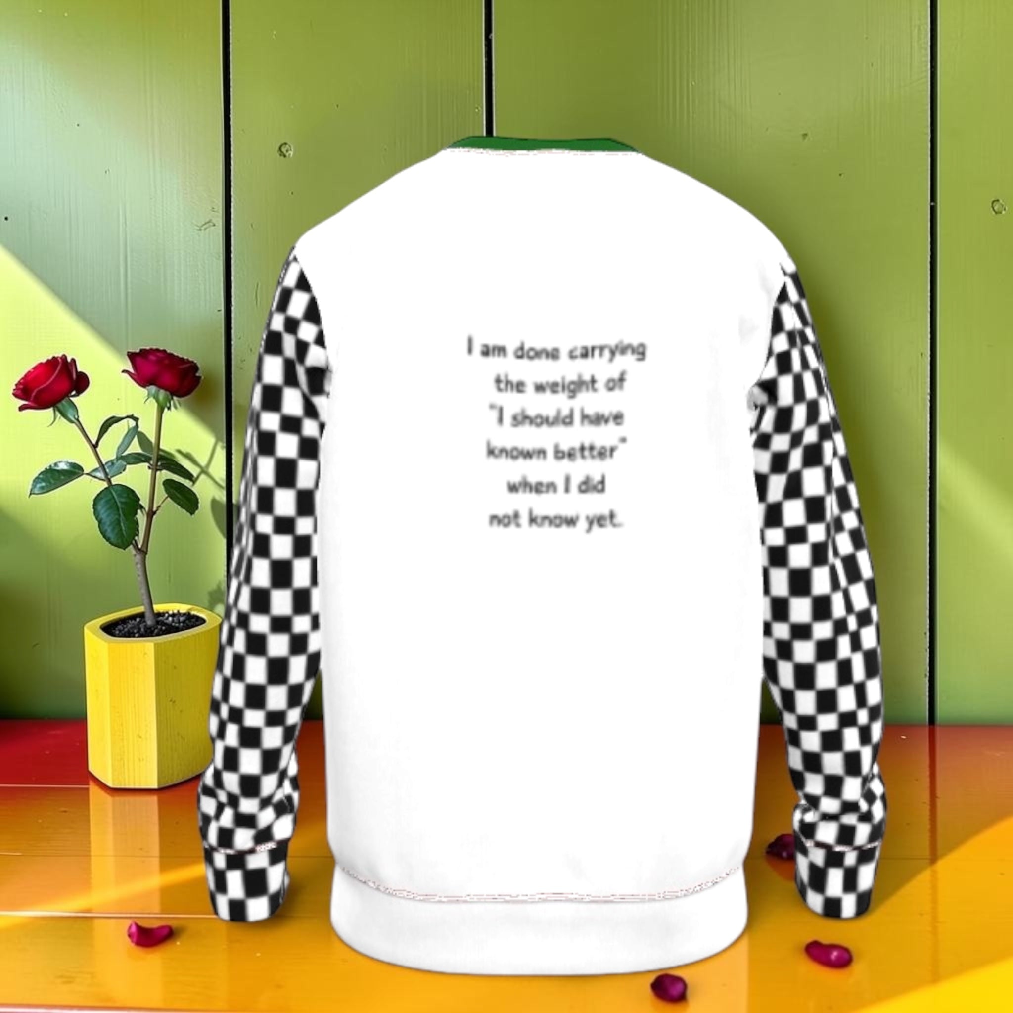Classic Iconic Sweatshirt - back view, white body with black and white checkered sleeves, featuring the quote 'I am done carrying the weight of I should have known better when I did not know yet'