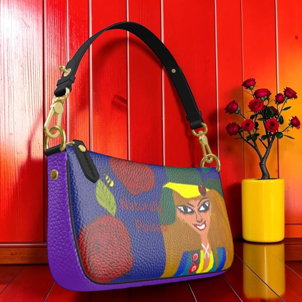 The Scarlett Grab & Go Bag — front angle, Doll Wall print with scarlett red side panel, gold hardware, red wall backdrop