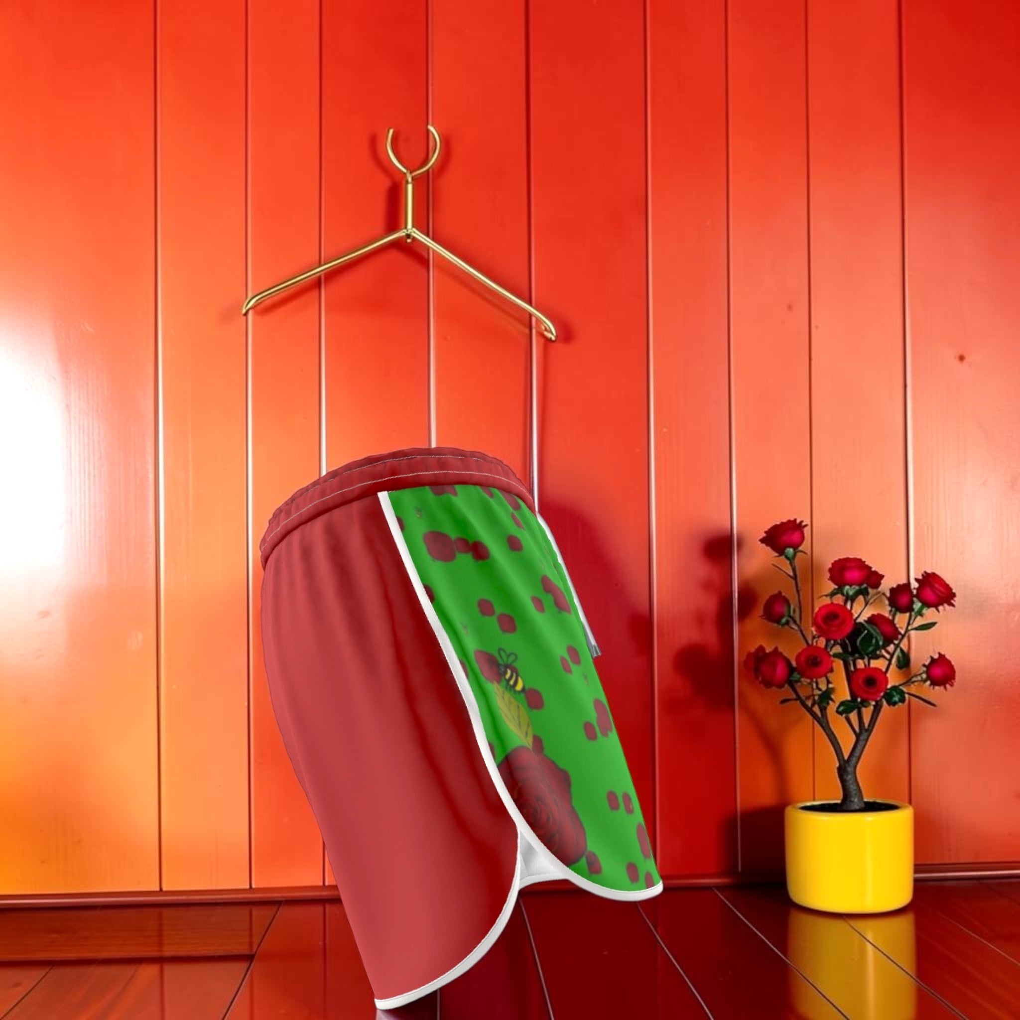 Vol II Chariot Anchored Shorts — side view showing solid scarlet red back panel with green spot print lining detail, Eden Edit
