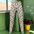 The Petal Voltage Ponte Pant front with yellow floral print and dark foliage.