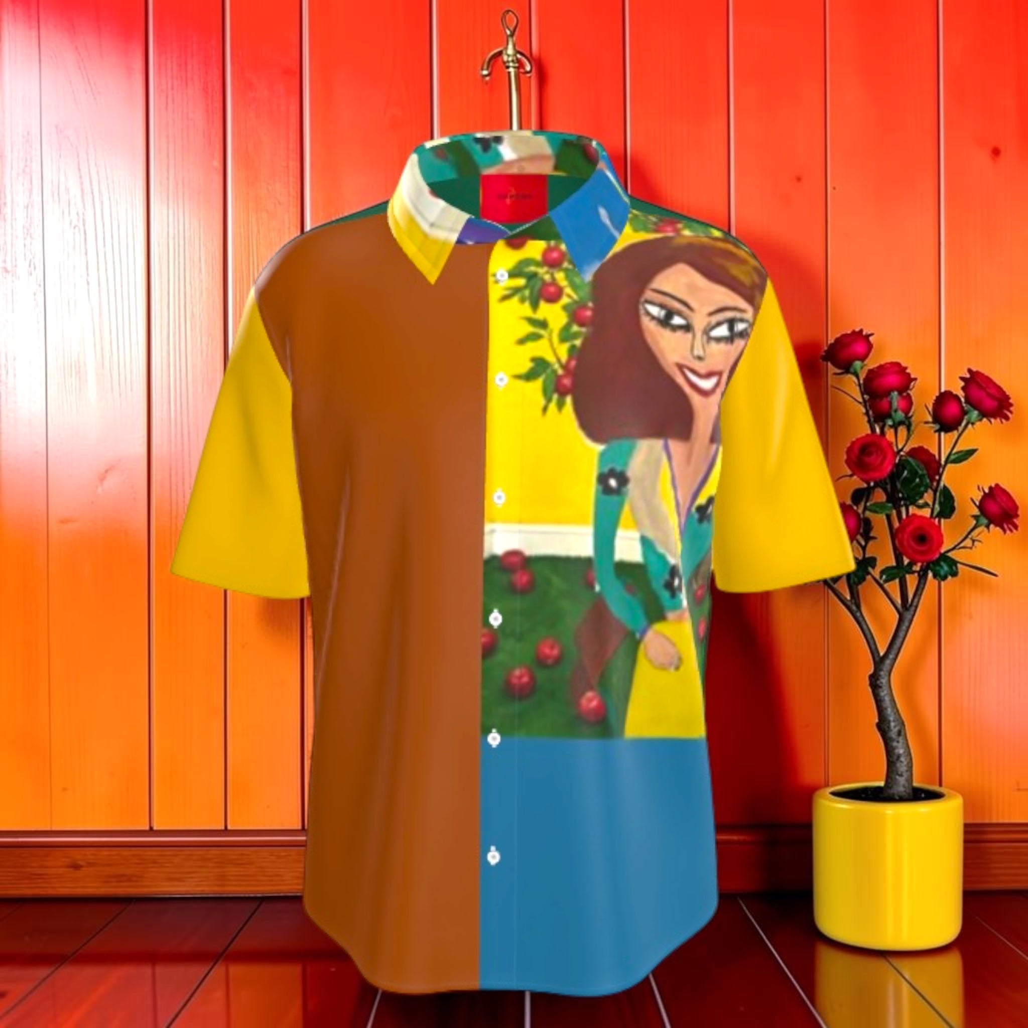 Vol II Eden Bloom Shirt front — color-block golden yellow and caramel panels with Doll Wall lady print and apple tree detail
