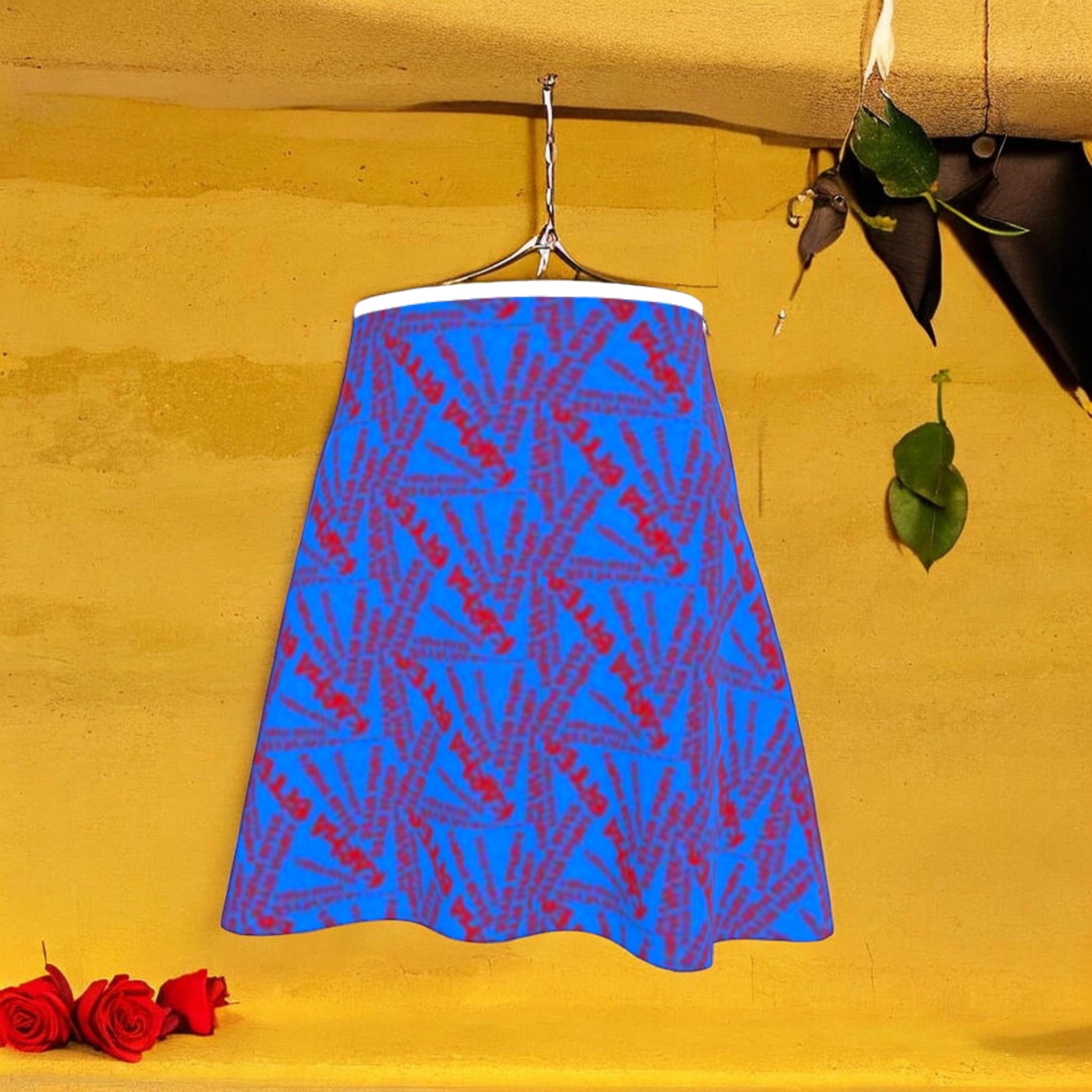 The Unbothered Skirt — cerulean blue A-line skirt with all-over scarlet red starburst print, white waistband, hanging against golden yellow wall with red roses. Vol III, Golden Expression Art.