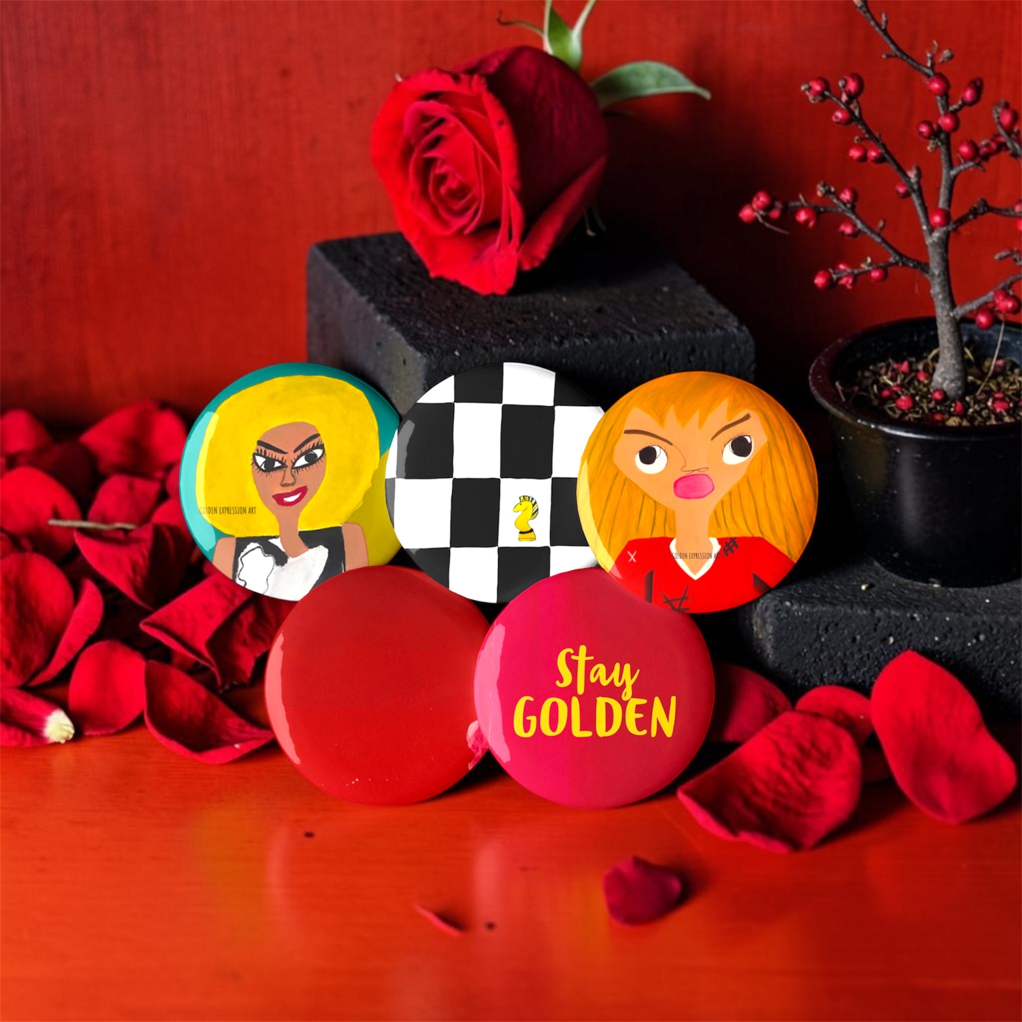 Vol IV The Golden Pins — collector set styled on red surface with roses and rose petals, GEA Vol IV editorial