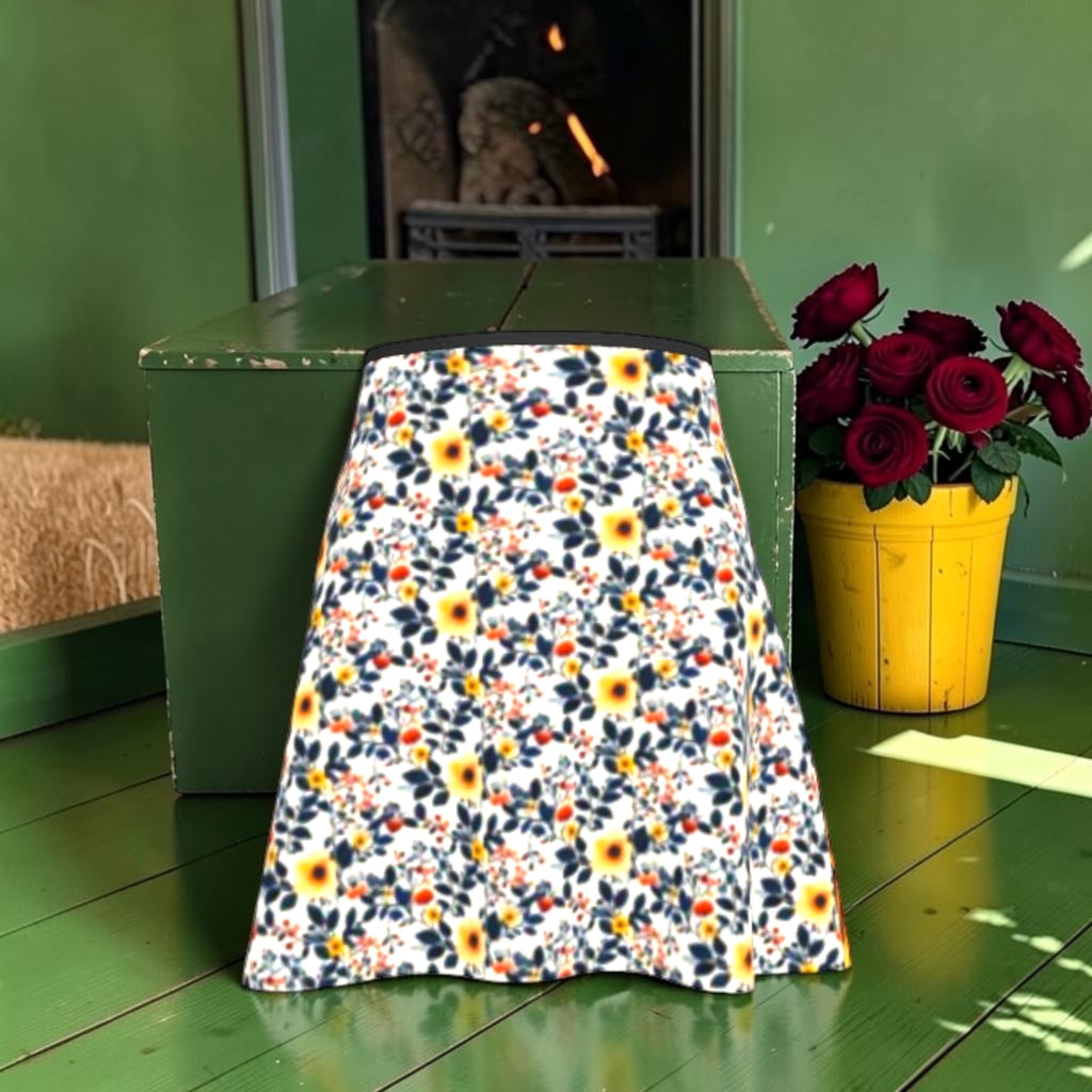 The Bloom & Bite Flared Skirt, floral-print view with yellow blooms, dark foliage and dark waistband.