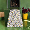 The Bloom & Bite Flared Skirt, floral-print view with yellow blooms, dark foliage and dark waistband.
